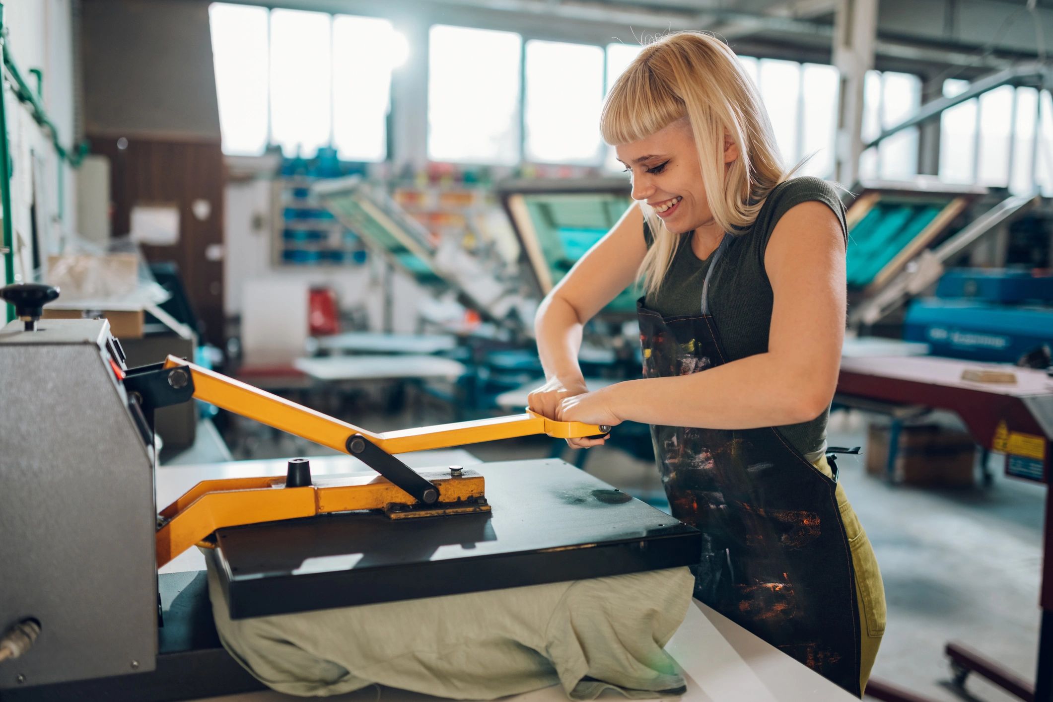 Technician operating a DTF printing machine